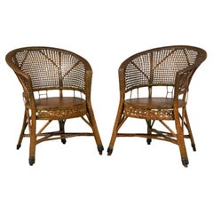 Pair of Mid-Century American Wicker & Cane Pull Up Armchairs
