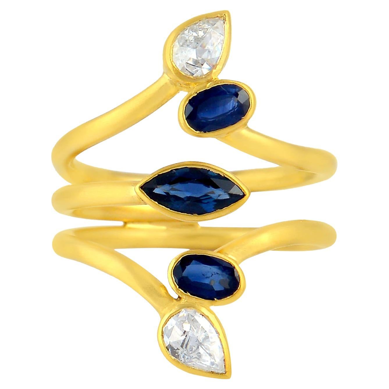 Multi Shaped Blue Sapphire Knuckle Ring With Pear Shaped Diamonds In 18k Gold For Sale