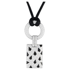 Cartier Collier pendentif panthère en or blanc 18 carats, diamant 2,85 carats et onyx 