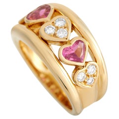 Van Cleef & Arpels Herzring aus 18 Karat Gelbgold mit 0,25 Karat Diamant und rosa Saphir