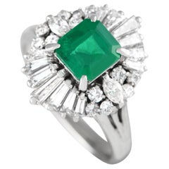 Platin-Ring mit 0,93 Karat Diamant und Smaragd 