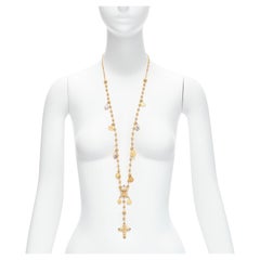 DOLCE GABBANA Collier long à breloques en or avec croix Sainte et pendentif en forme de pièce de monnaie