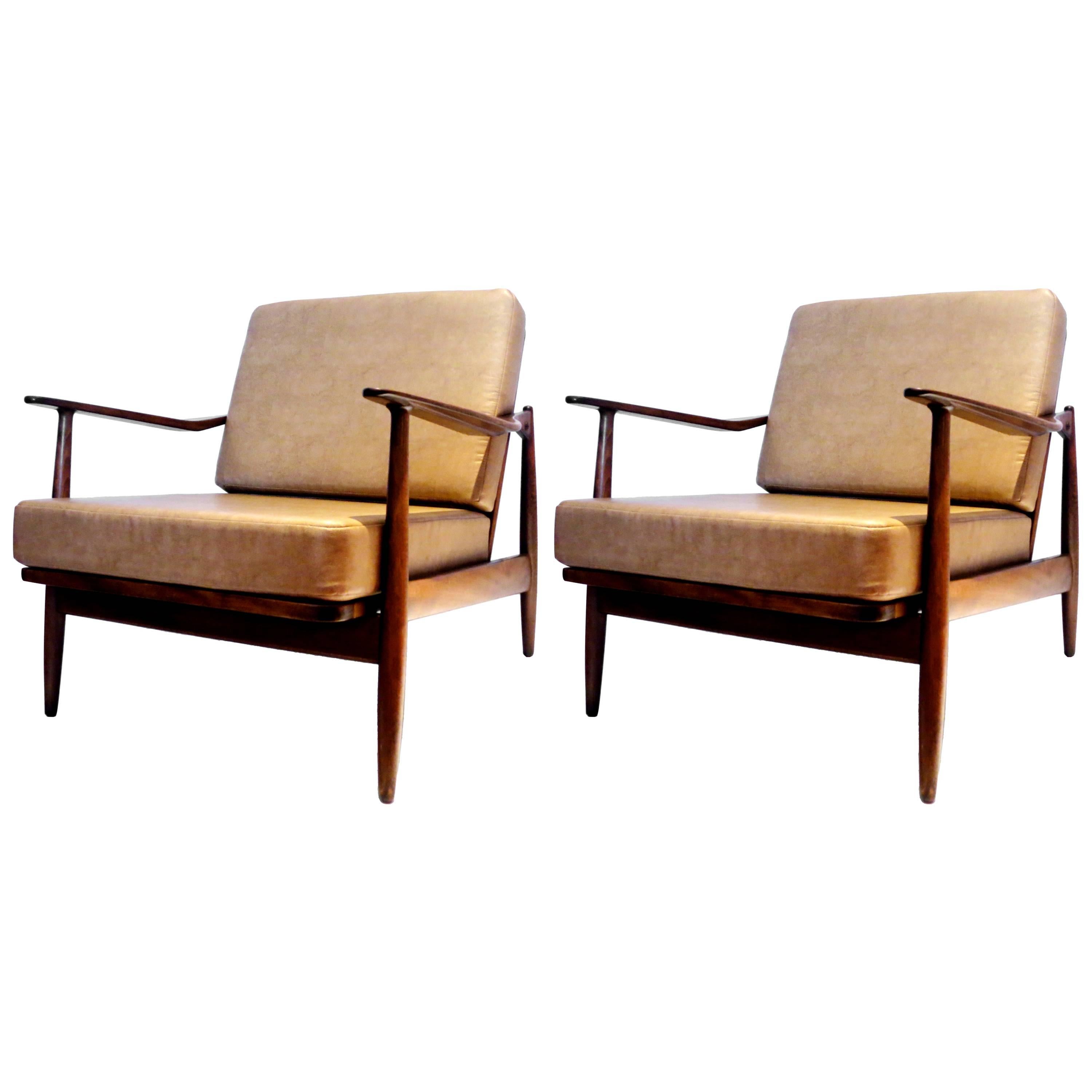 Pair of 1950s Danish modern walnut finish club chairs by Scandia
