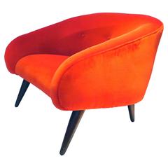Striking 1950s American modern lounge chair in red velvet fabric