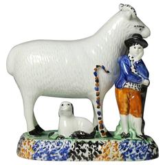 Yorkshire pottery figure a ram with diminutive shepherd.antique period c1810