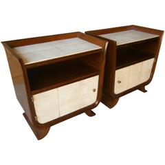 A Lyrical Pair of 1940's Italian Walnut Bedside Cabinets with Parchment Surfaces