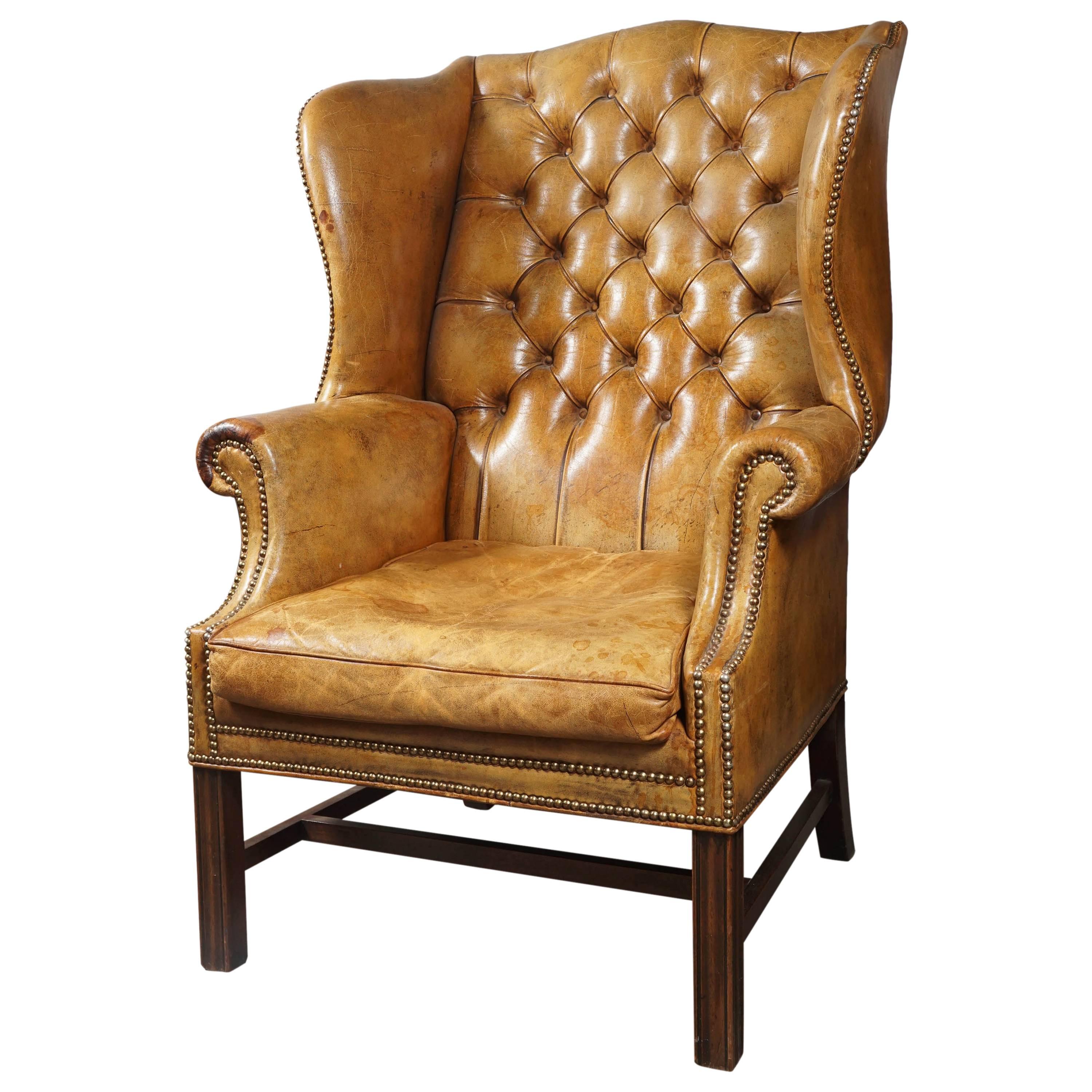 Tufted leather wingback chair