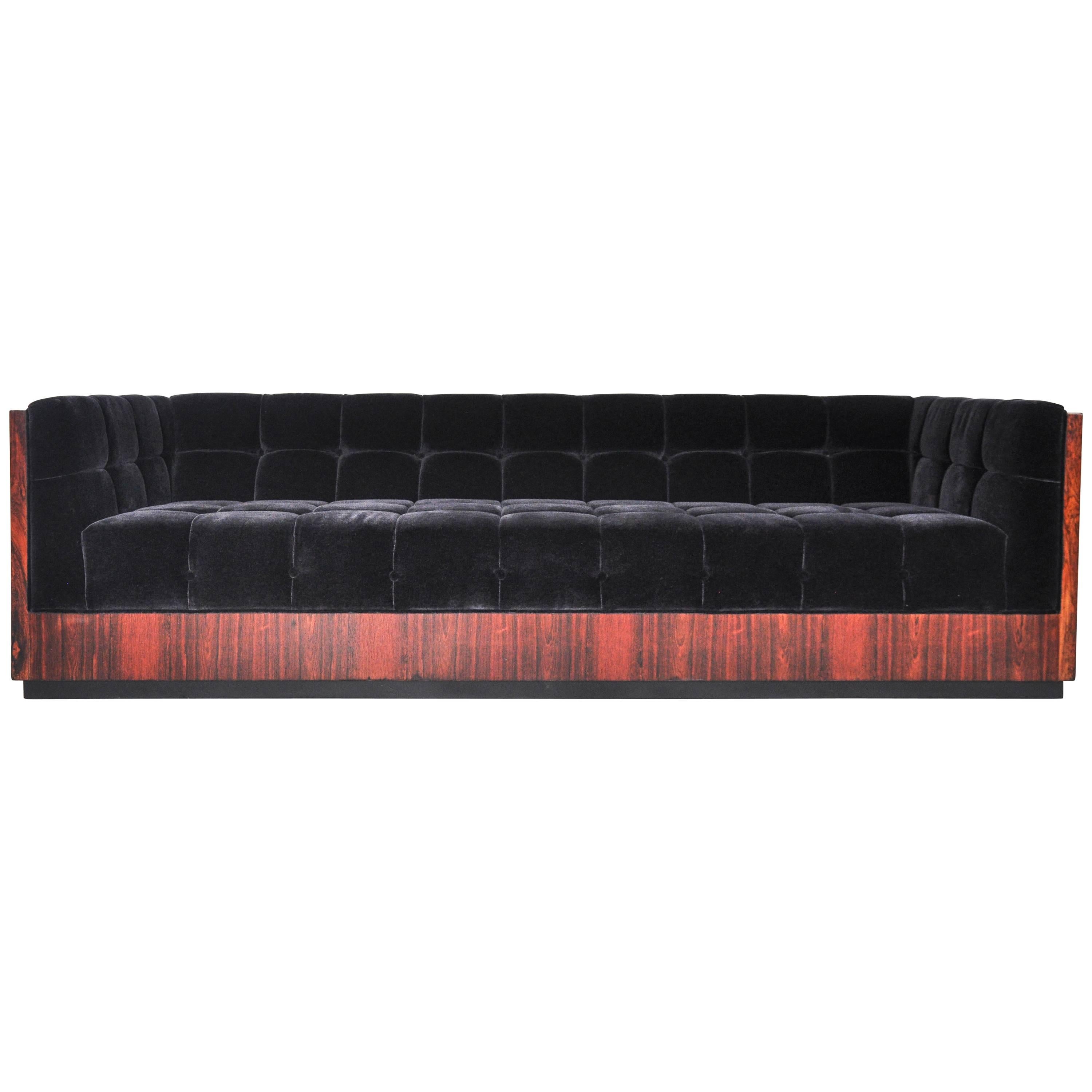 Rosewood case sofa upholstered in tufted black mohair. Designed by Milo Baughman. Figural rosewood grain. Fully restored and reupholstered.