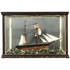 "Ship in Heavy Seas" Model in Cylinder Glass Vitrine, 1900