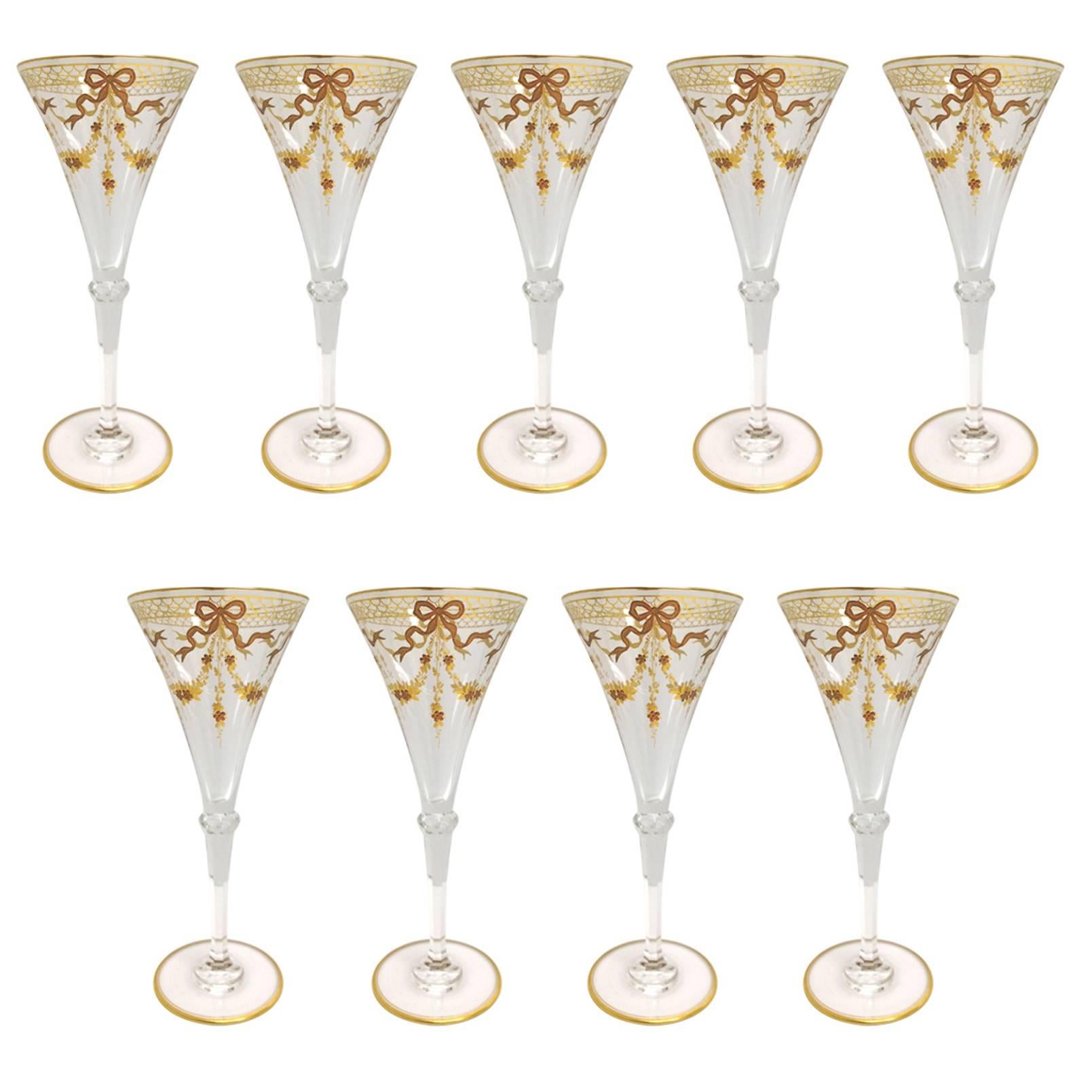 Nine Rare Moser Glass Campagne Flutes Richly Gilded in Two Tones, circa 1900