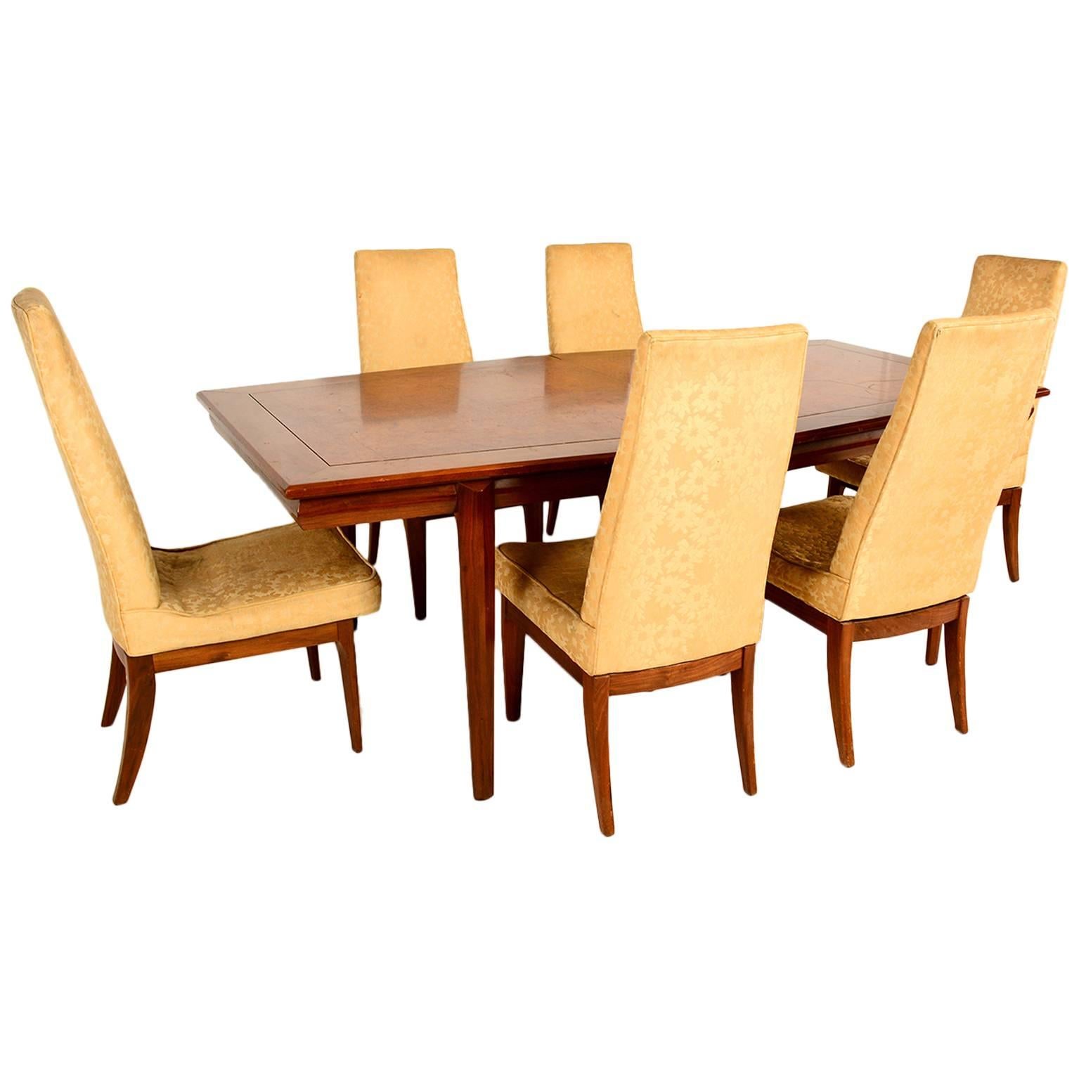 For your consideration a vintage dining table designed by Monteverdi & Young.

Solid walnut wood with burl wood veneer top.

Sculptural diamond shape with amazing quality. 

Chairs listed in another posting. 

Table includes two leaves