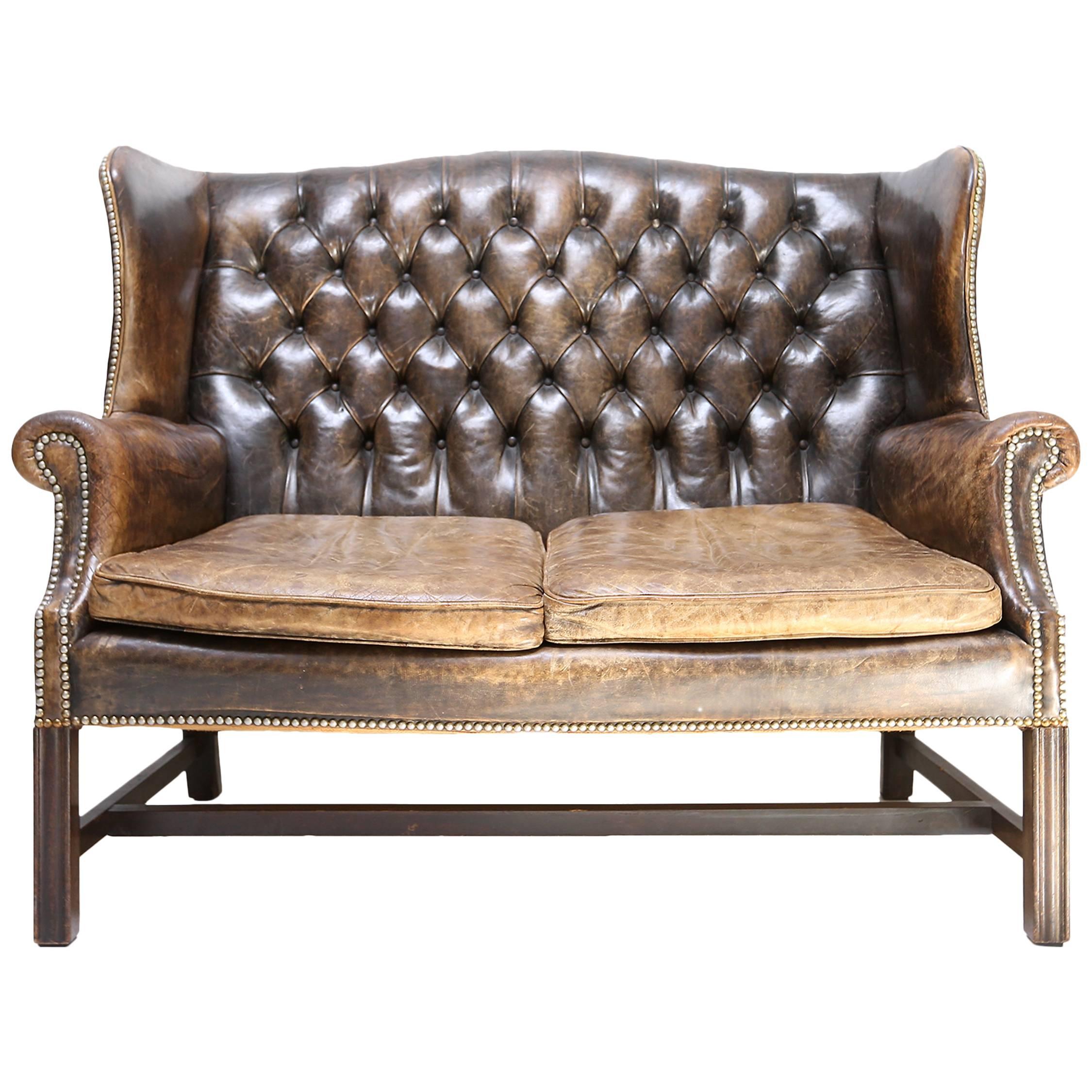 Chesterfield wingback tufted leather sofa
