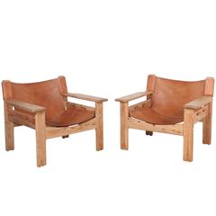 Pair of Wide Arm Bernt Petersen Leather and Oak Lounge Chairs