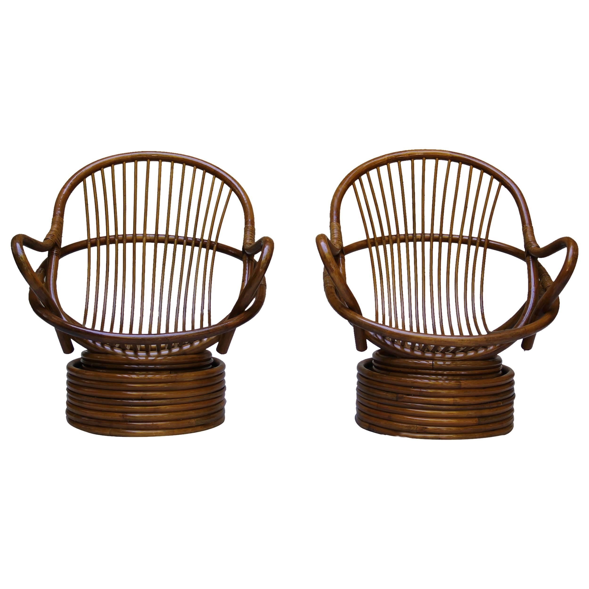 A beautiful pair of bamboo rattan swivel chairs. Manufactured by Sun Products of Vernon California. The Classic Californian lounge chair.
New upholstery and in excellent condition. 
To view please make an appointment at our Laguna Beach location.