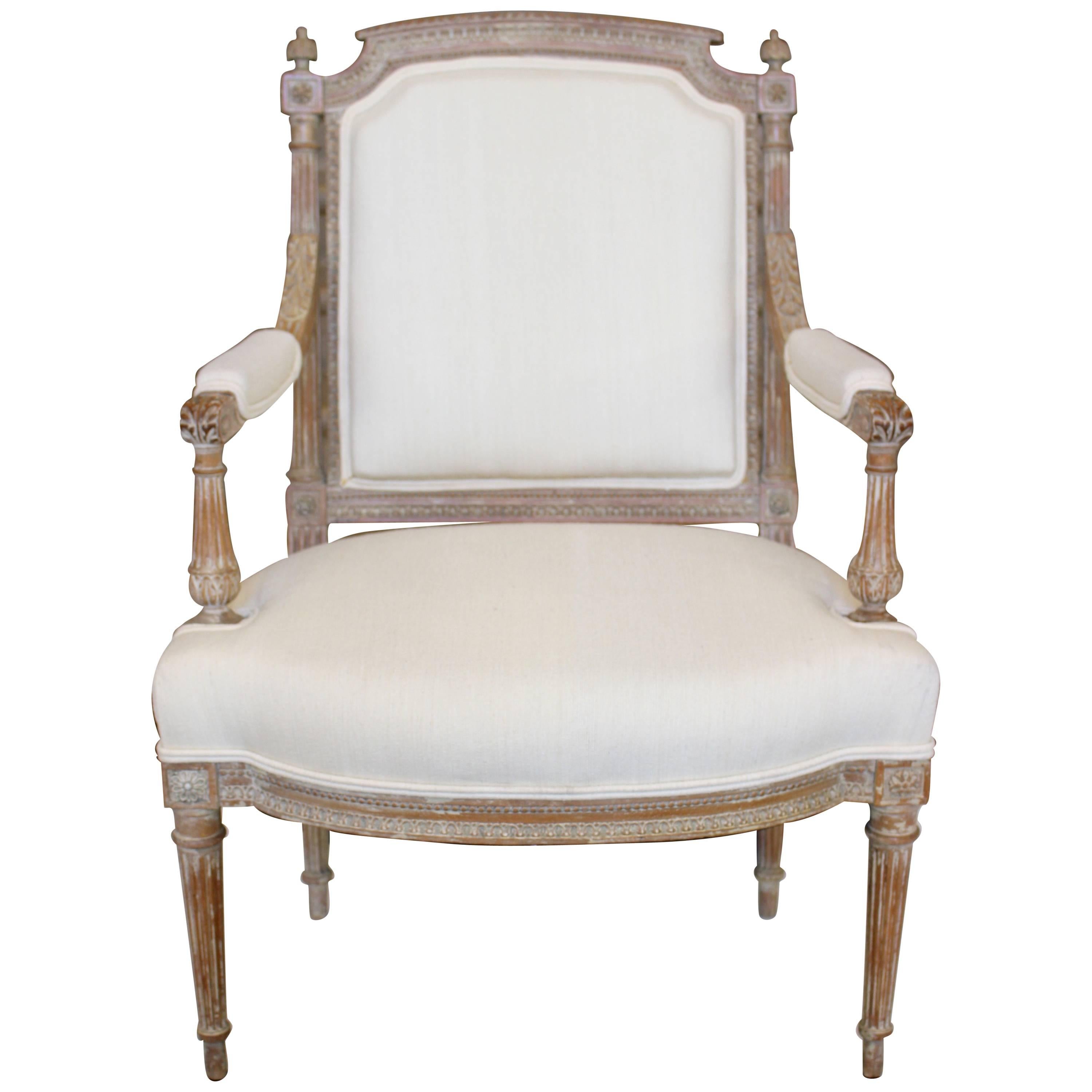 French Louis XVI Style 19th Century Fauteuil with Fluted Accents and Upholstery