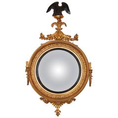 Fine Regency Parcel Ebonized Giltwood Girandole