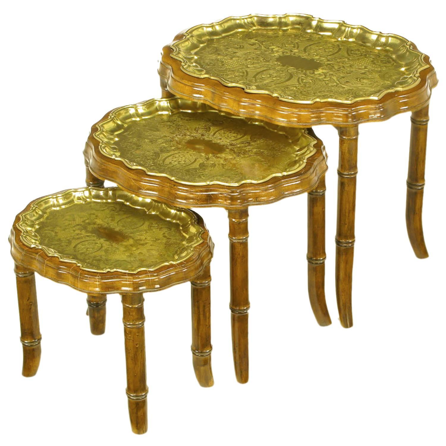 Three Carved Walnut and Etched Brass Tray Nesting Tables