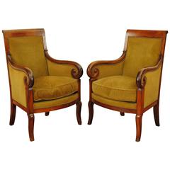 Pair of French Restauration Period Walnut and Upholstered Bergeres