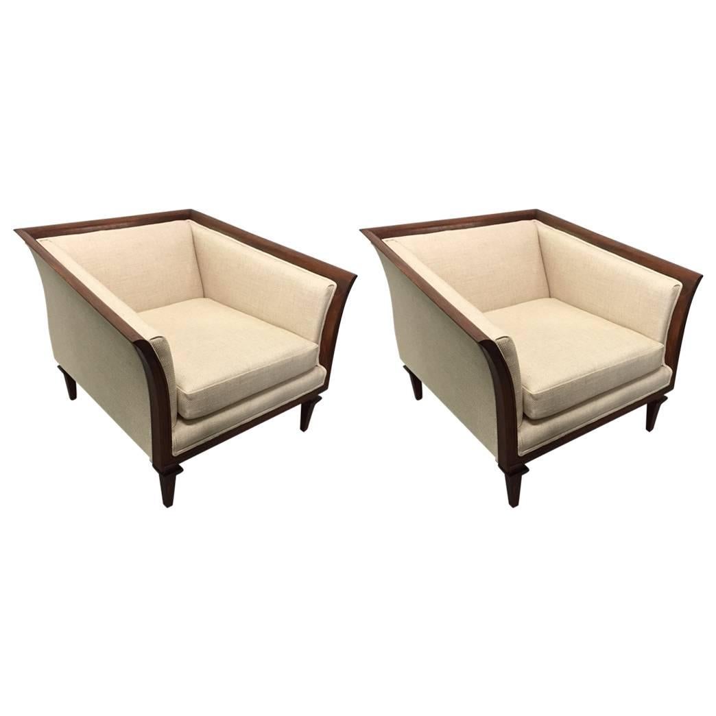 Pair of sculptural walnut lounge chairs upholstered in a linen-blend.  