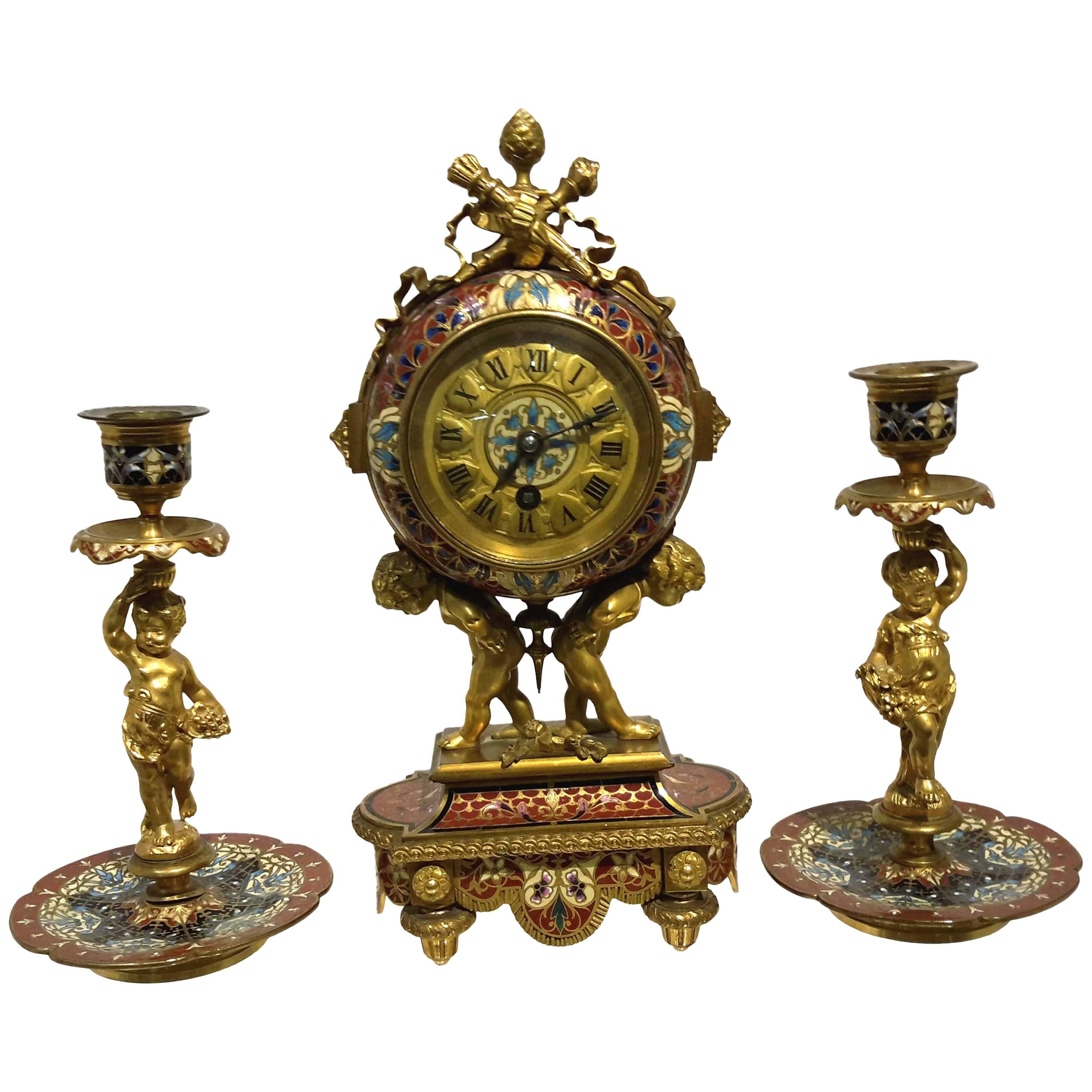 Three-Piece Champleve and Gilt Bronze French Figural Clock Garniture 
