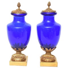 Pair of Cobalt Blue and Doré Bronze Urns