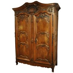 18th Century Country French Louis XV Carved Walnut Armoire from Lyon