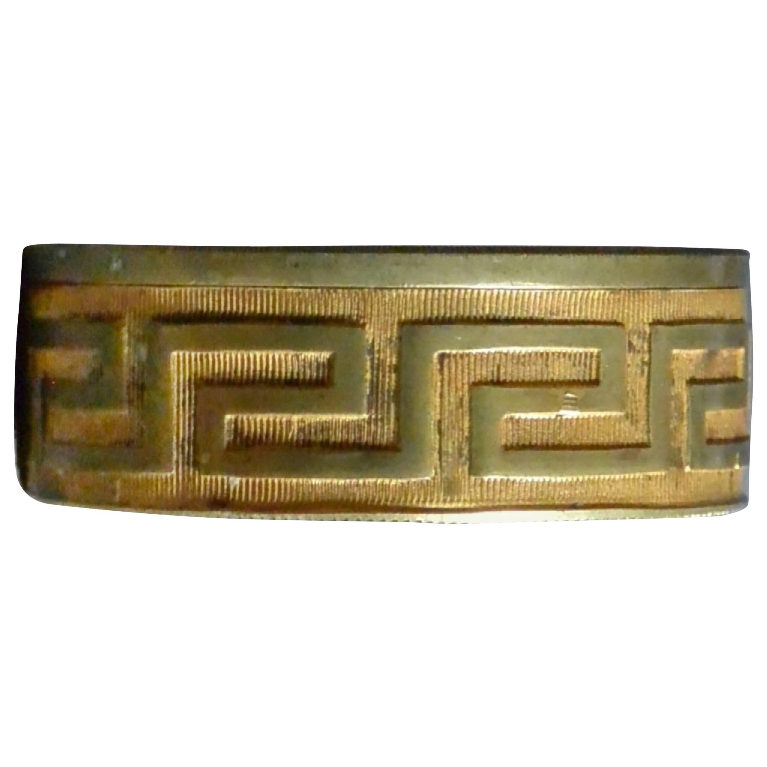 Greek key file sided gilt brass snuff box with raised profile of George III and Latin inscription, England, early 19th century. 
Dimension: 2
