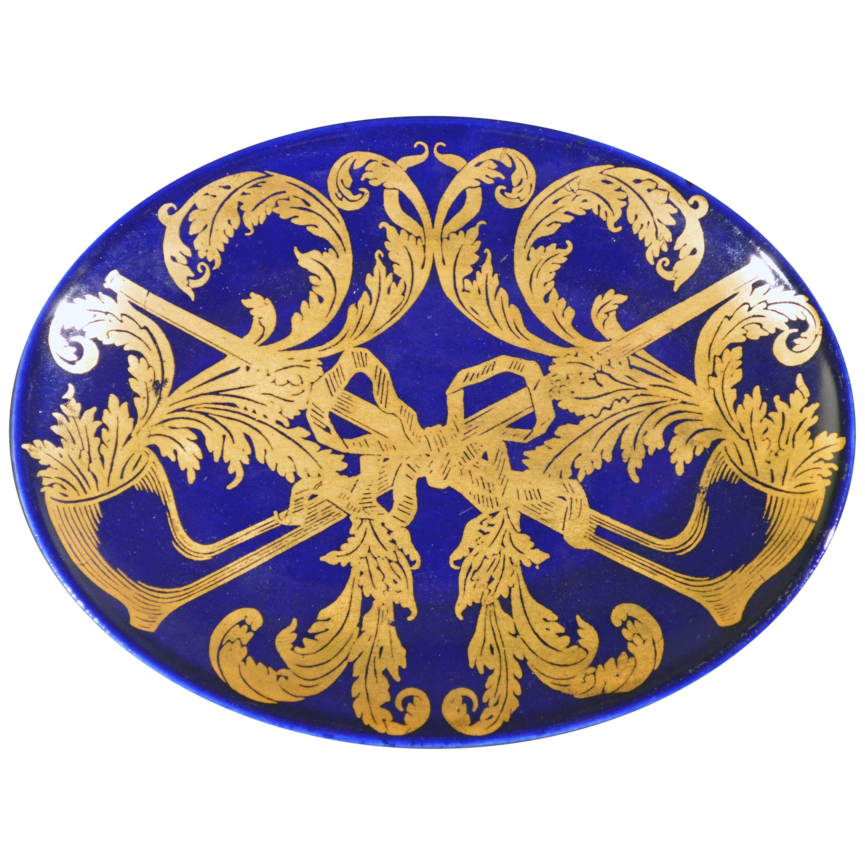 Ovale Schale von Piero Fornasetti mit vergoldetem Pfeifen- und Tabakmotiv im Angebot