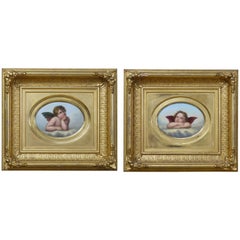 Pair of Porcelain Plaques After Raphael's Cherubs in the Sistine Madonna