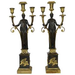 Pair of French Empire Patinated and Gilt Bronze Figural Candelabra