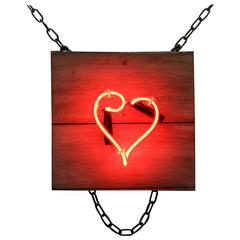 Red Neon Heart with Curl on Salvaged Wood