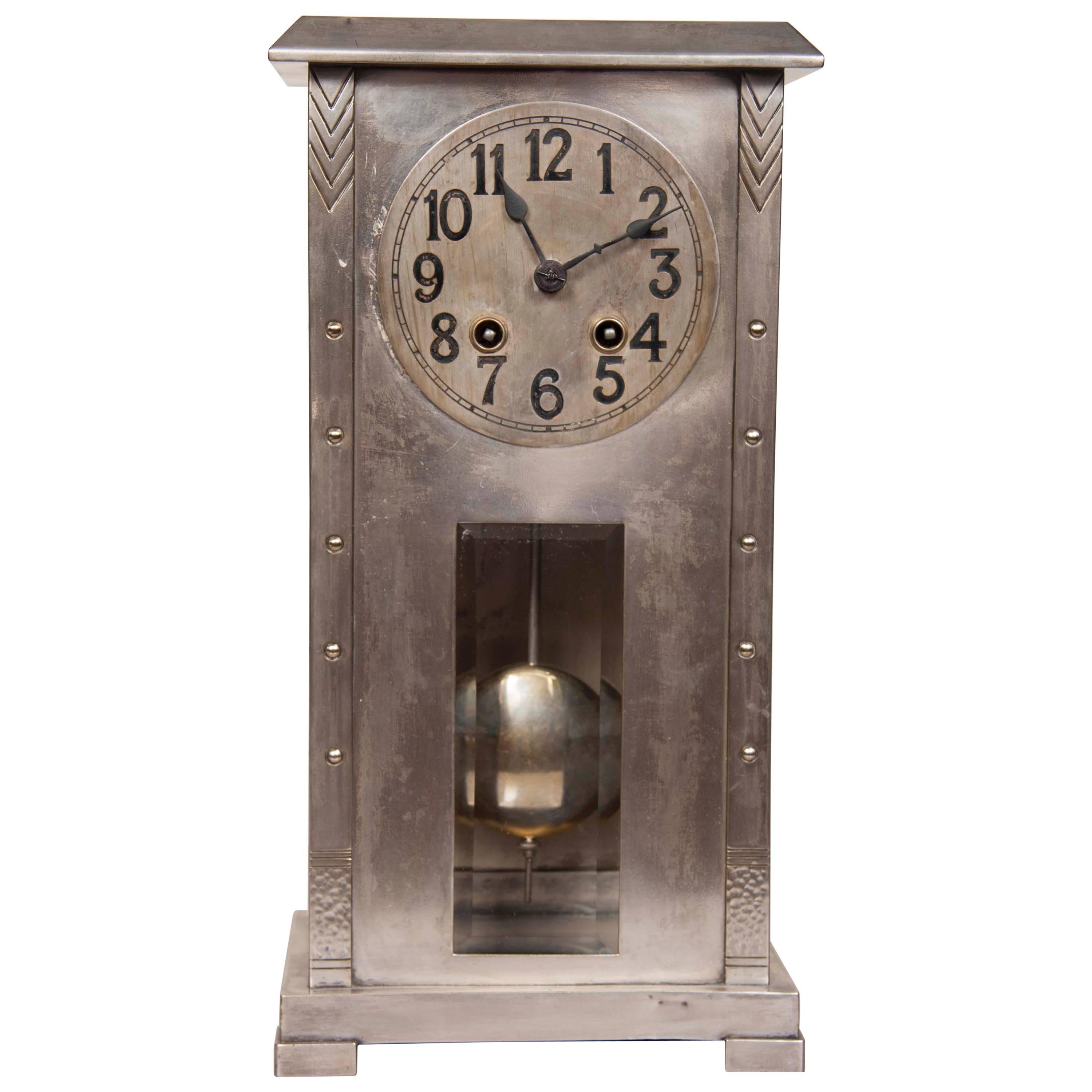 A WMF silver plate over Britannia-metal case clock