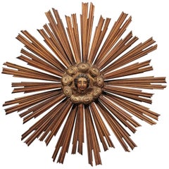 French 19th Century Gilt and Painted Starburst with Carved Angel Face and Clouds