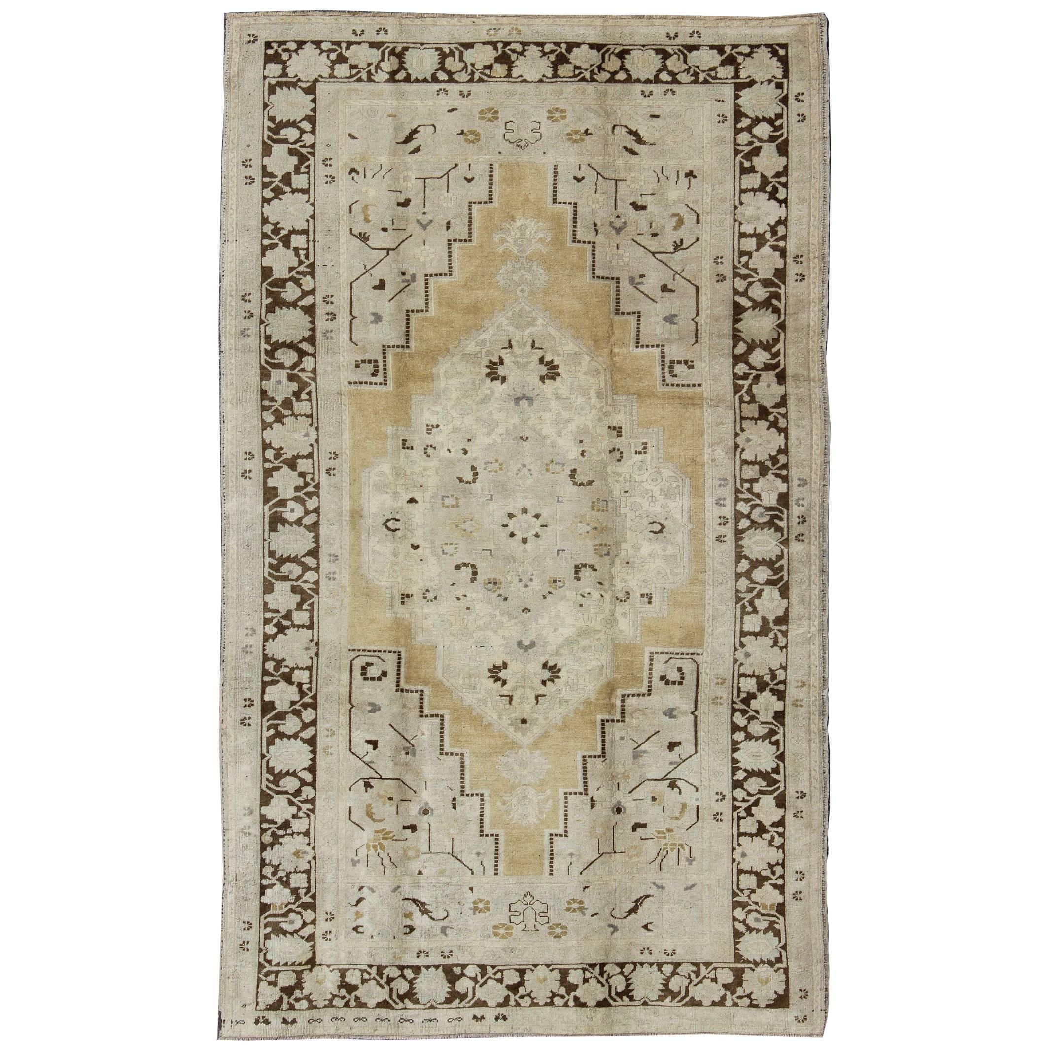 Turkish Oushak Rug in Pale Yellow, Taupe and Brown Border For Sale