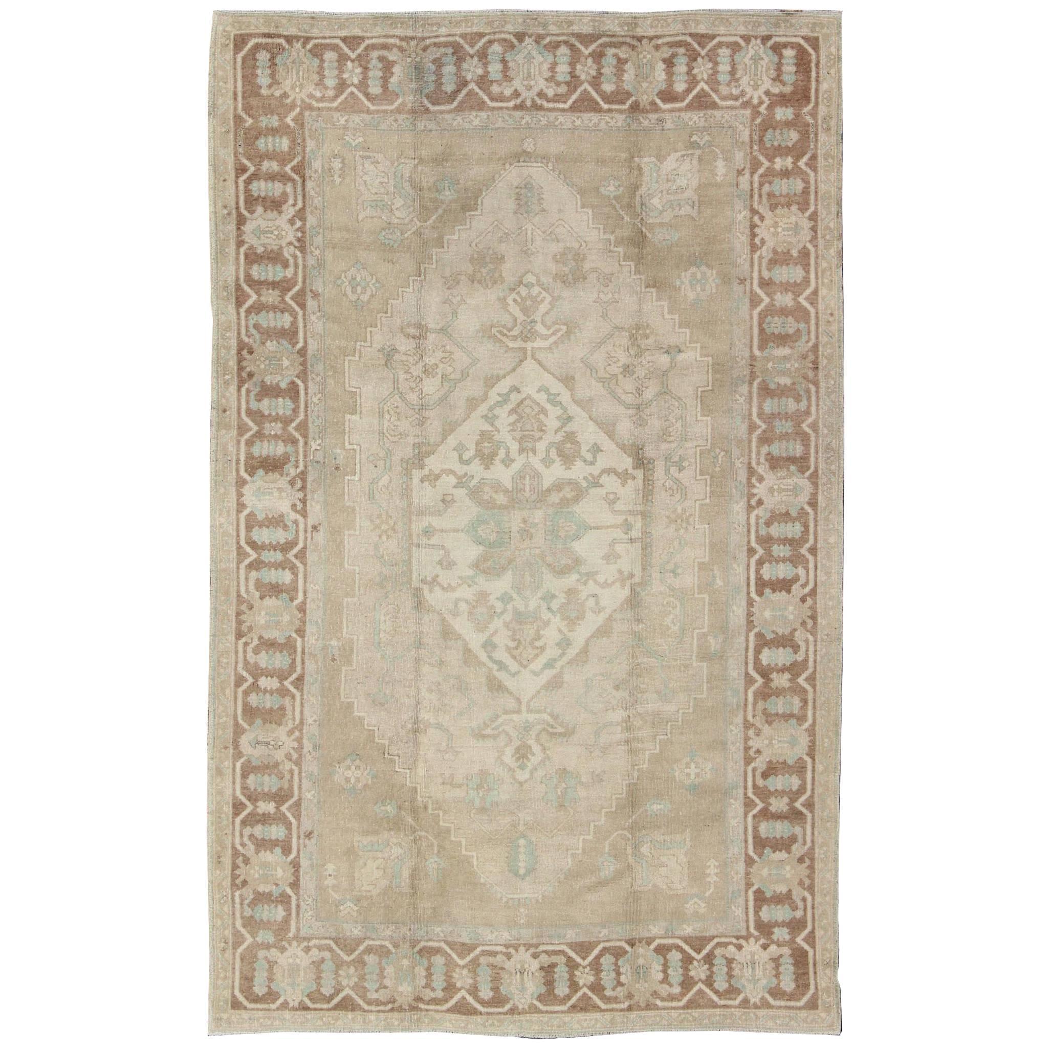 Vintage Oushak Medallion Rug With Muted Colors and Earth Tones For Sale