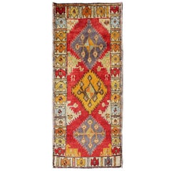 Tribal Turkish Oushak Runner with bright colors in Red, Gold, Yellow and Orange