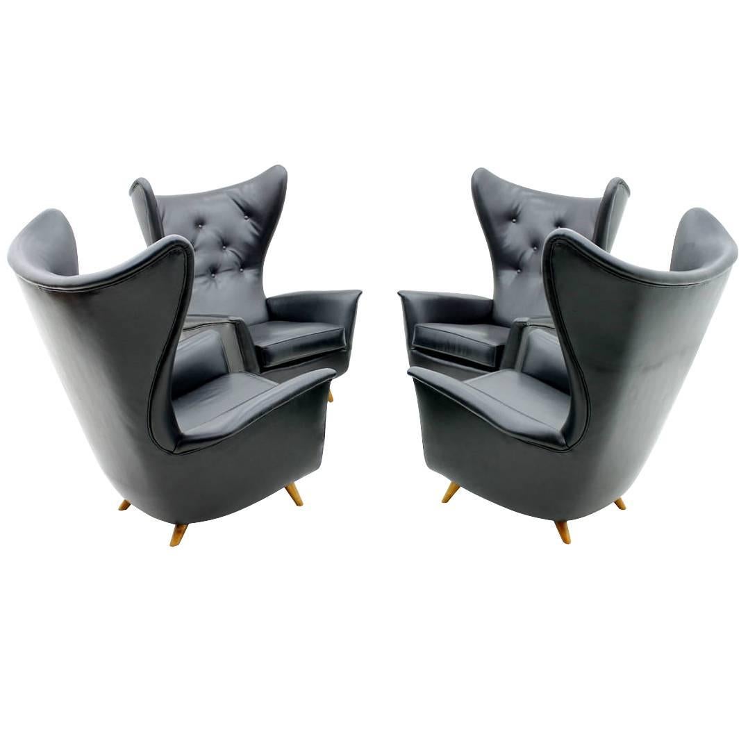 Four Black Leather Wing Lounge Chairs, 1950s For Sale