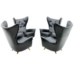 Four Black Leather Wing Lounge Chairs, 1950s