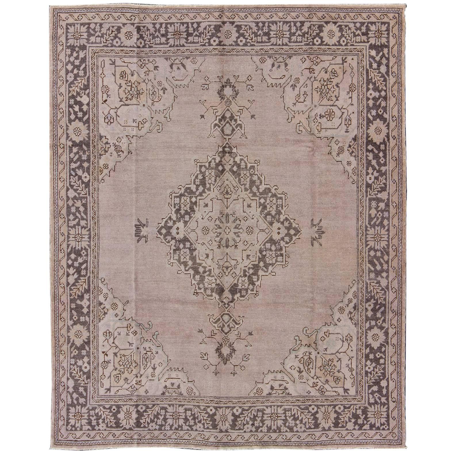 Antique Oushak With Medallion design in Lavender, Charcoal Brown, pale blue  For Sale