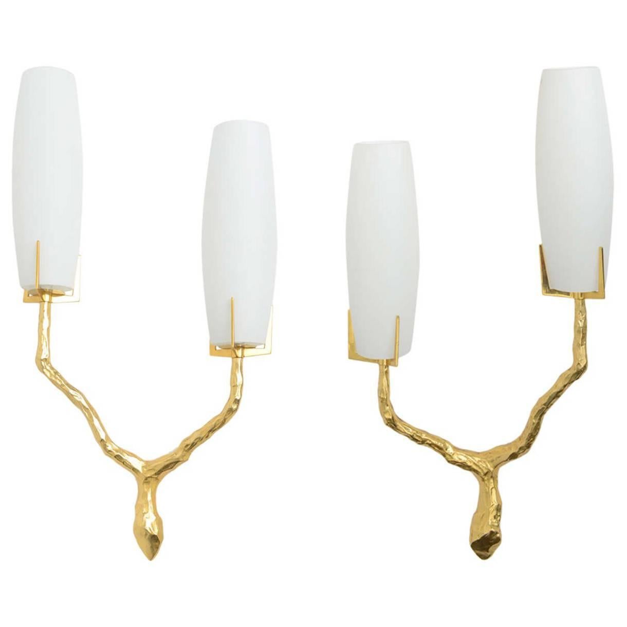 Pair of French modern gilt bronze and glass wall lights by Maison Arlus, 1960's. All in gilt bronze in branch form, with frosted glass.