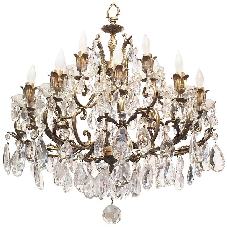Continental Gilt Metal and Crystal Sixteen-Light Chandelier at 1stdibs