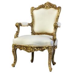 Italian Heavily Carved and Gilded Rococo Open Armchair
