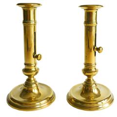 Pair of French Brass Round Base Side Ejector Candlesticks, circa 1820