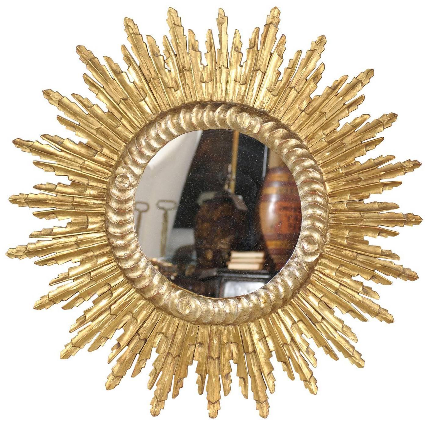 French Mid-Century Giltwood Sunburst Mirror with Sunrays of Varying Size