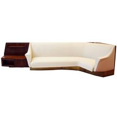Important Wall Unit, Large Curved Sofa and Mahogany Shelfs by Dassi, 1940