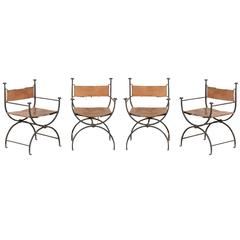 A Set of Four Italian Savonarola Iron Frame and Brown Leather Chairs