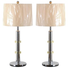 Paire de lampes vintage de style Jansen en chrome et laiton