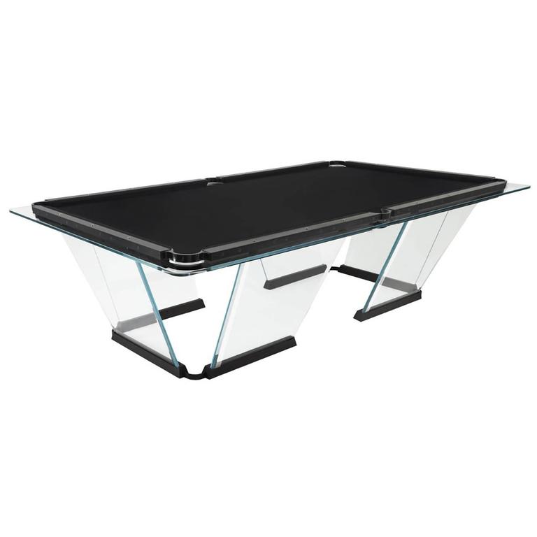 T1 is a billiard-pool table made entirely of glass, where the playing surface is specially treated reproducing the friction of traditional cloth.
The feet are sheets of glass bevelled on both sides that self-stabilize, the support is made of solid