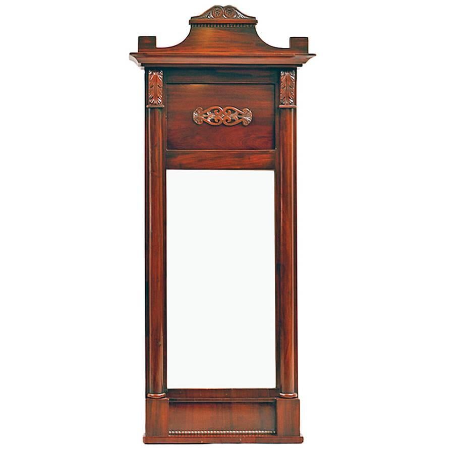 From the reign of Christian VIII this Danish Empire mirror in mahogany has a carved bonnet and pilasters capped with carved acanthus leaves flanking original mirror, Denmark, 1830.
Perfect fit in a small bathroom.
Measures: 20 3/4
