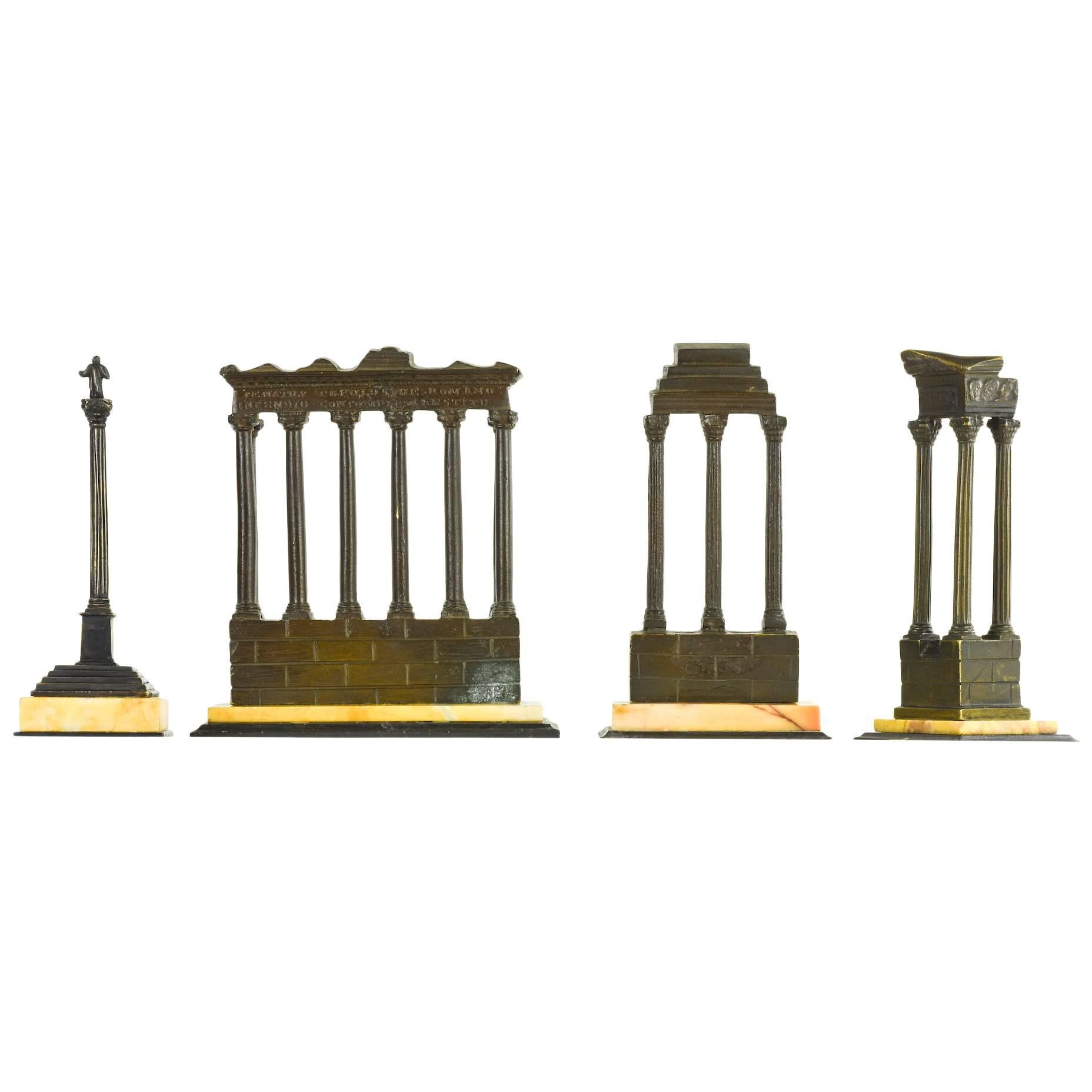 A set of four, later 19th century, bronze and marble models of the Roman Forum.
Dark patinated bronze with Giallo and Nero marble bases,
Rome, 5” H, circa 1880.

An unusual, intact set of Grand Tour souvenirs of ruined temples and a monument in
